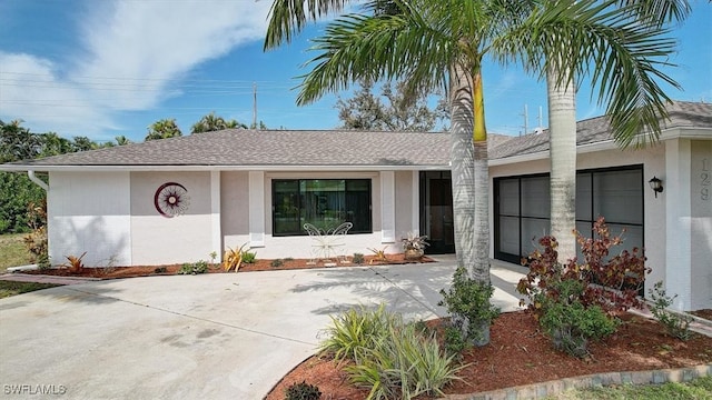 doorway to property with a garage