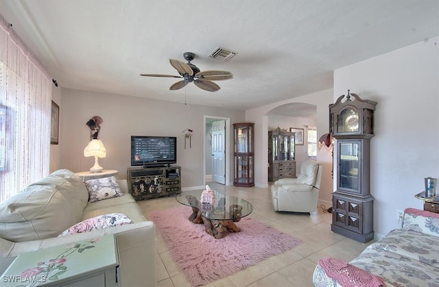 living room with ceiling fan and light tile patterned floors