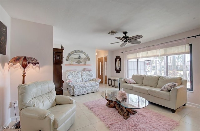 living room with ceiling fan and light tile patterned floors