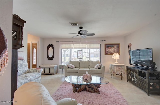 tiled living room with ceiling fan