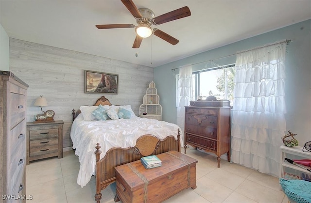 tiled bedroom with ceiling fan