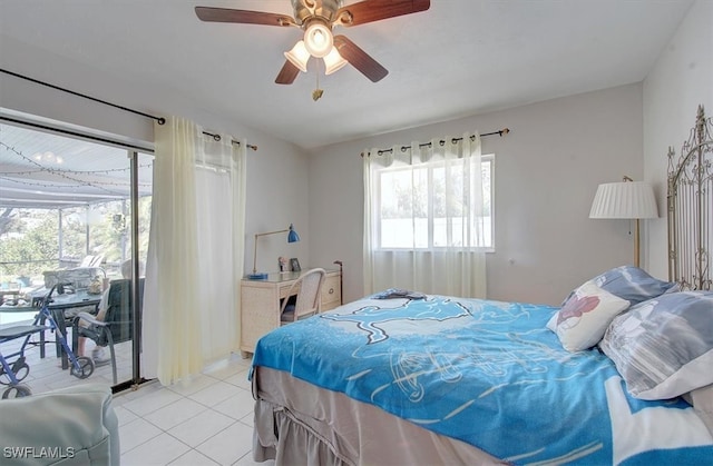 tiled bedroom featuring ceiling fan