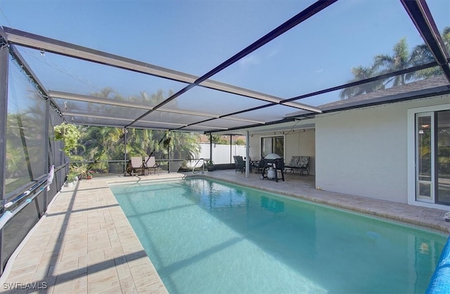 view of pool featuring a patio area and a lanai