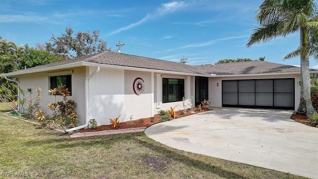 single story home with a front lawn and a garage