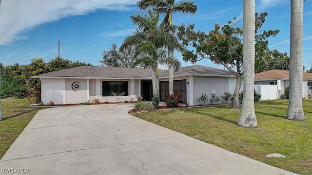 ranch-style house with a front lawn and a garage