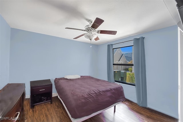 bedroom featuring ceiling fan and dark hardwood / wood-style flooring