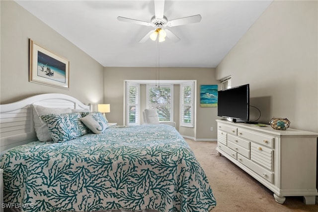 carpeted bedroom featuring ceiling fan and lofted ceiling