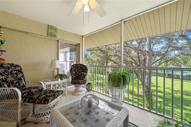 sunroom featuring ceiling fan