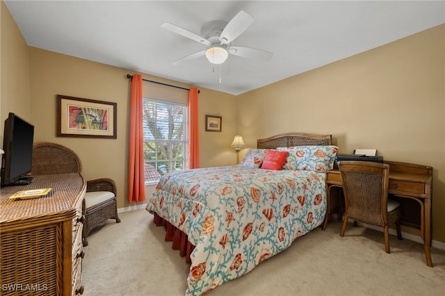 bedroom featuring light carpet and ceiling fan