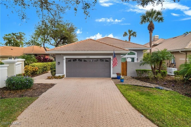 ranch-style home featuring a garage