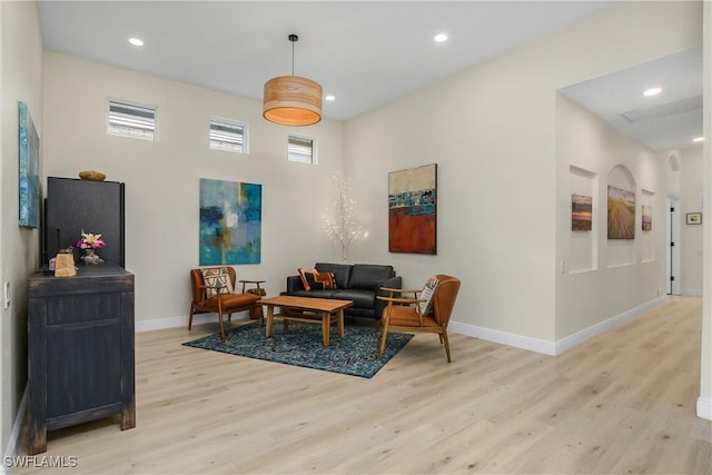 living room with light hardwood / wood-style flooring