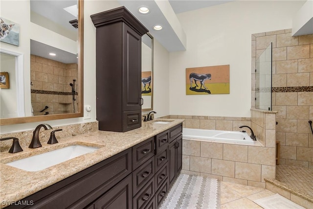 bathroom featuring tile patterned floors, separate shower and tub, and vanity