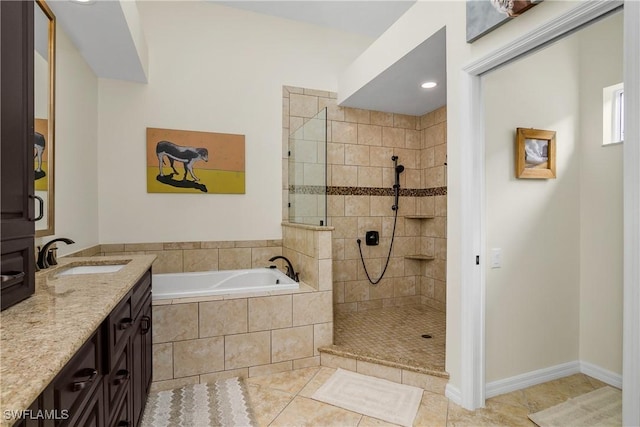 bathroom with vanity, tile patterned floors, and independent shower and bath