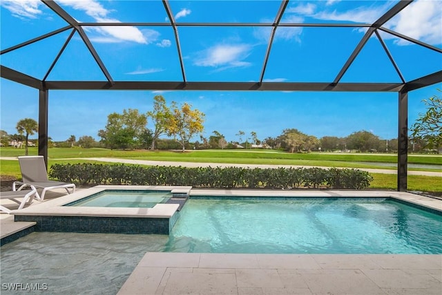 view of pool with an in ground hot tub, a patio, and glass enclosure