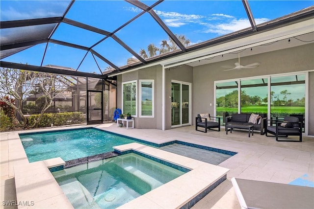 view of swimming pool with an outdoor living space, an in ground hot tub, a lanai, and a patio