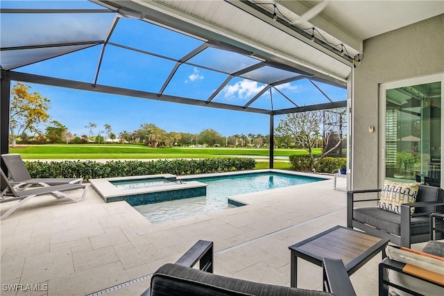 view of swimming pool featuring an in ground hot tub, a lanai, and a patio