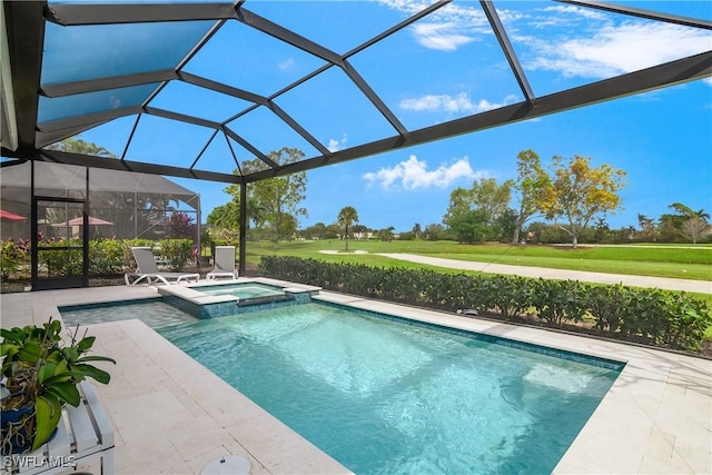 view of pool with an in ground hot tub, a lanai, and a patio