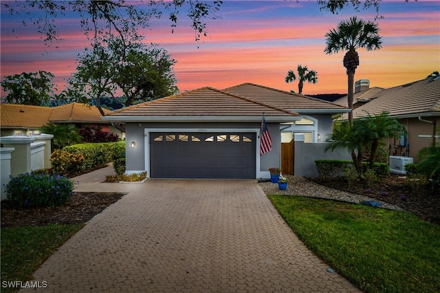 ranch-style home featuring a garage