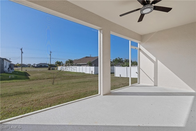 view of patio featuring ceiling fan