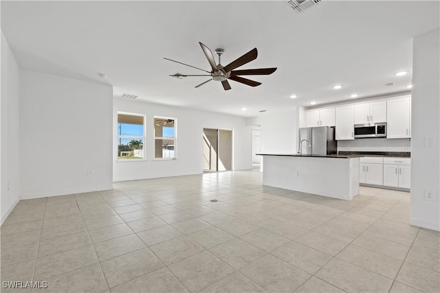 interior space featuring ceiling fan and light tile patterned flooring