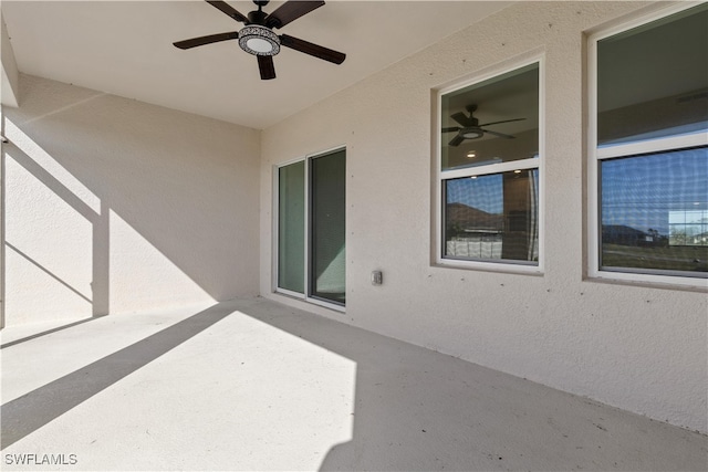 view of patio featuring ceiling fan