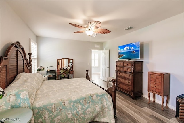 bedroom featuring hardwood / wood-style floors and ceiling fan