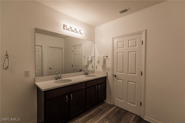 bathroom featuring vanity and hardwood / wood-style flooring