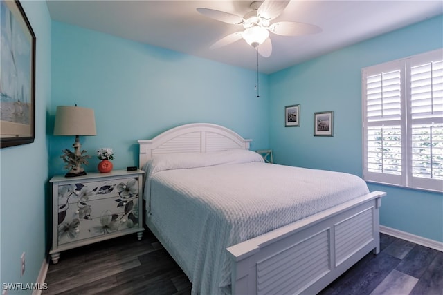 bedroom with ceiling fan and dark hardwood / wood-style flooring