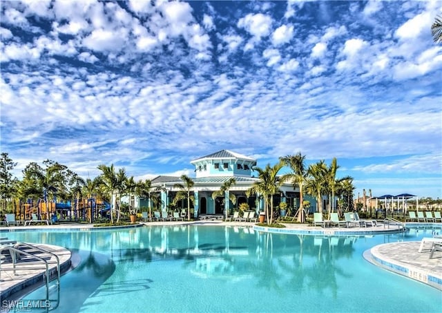 view of pool featuring a playground