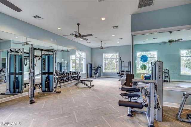 exercise room featuring light colored carpet