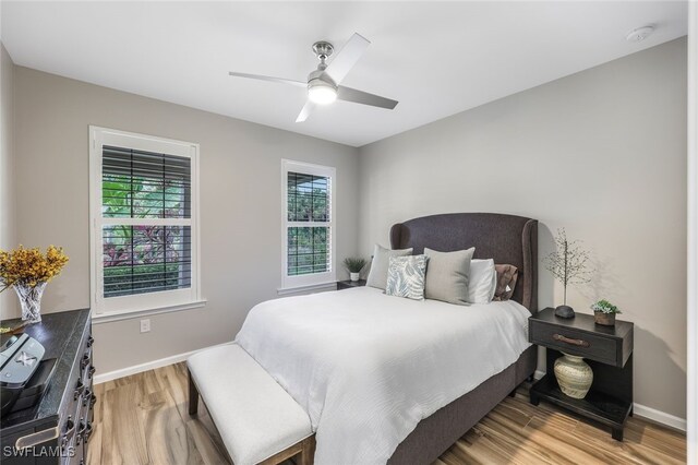 bedroom featuring ceiling fan and wood-type flooring