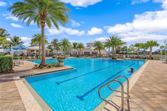 community pool with a patio area