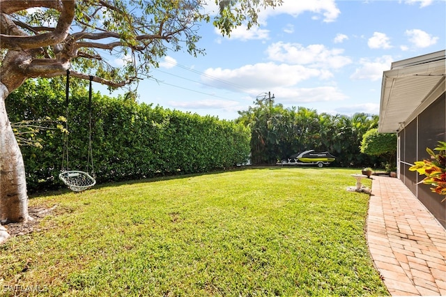 view of yard with a sunroom