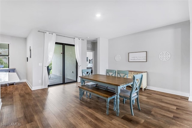 dining room with dark wood-type flooring