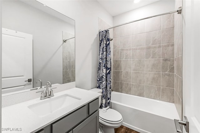 full bathroom with vanity, shower / bath combo with shower curtain, wood-type flooring, and toilet