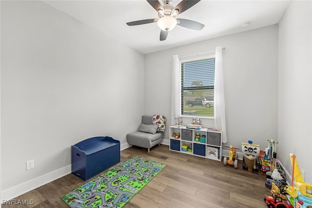 recreation room featuring ceiling fan and hardwood / wood-style floors