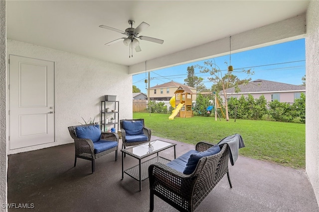 view of patio featuring ceiling fan and a playground