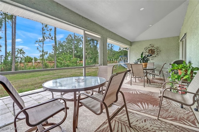 sunroom with lofted ceiling