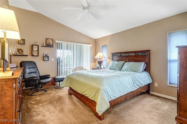 carpeted bedroom with vaulted ceiling and ceiling fan