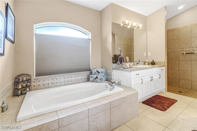 bathroom featuring vanity, tile patterned floors, and separate shower and tub