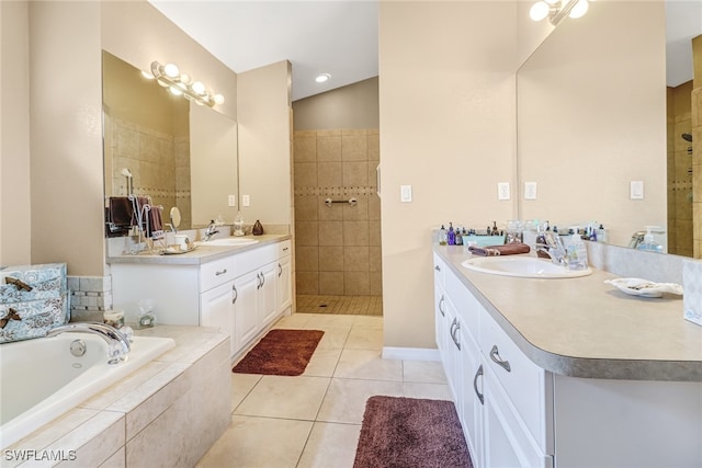 bathroom featuring vanity, lofted ceiling, separate shower and tub, and tile patterned flooring