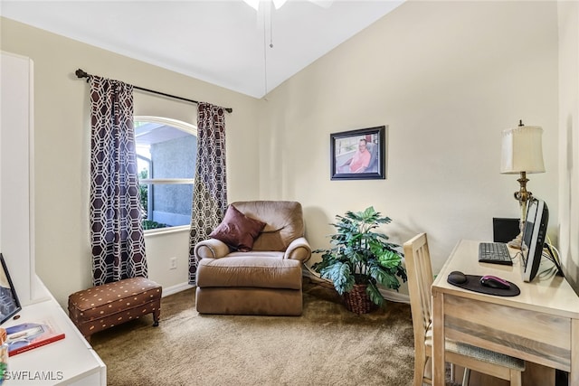 sitting room with vaulted ceiling and carpet flooring