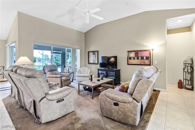 tiled living room featuring ceiling fan and vaulted ceiling