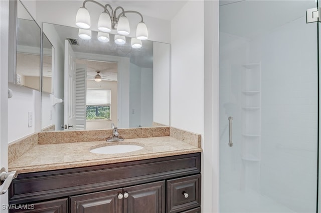 bathroom featuring vanity, walk in shower, and ceiling fan