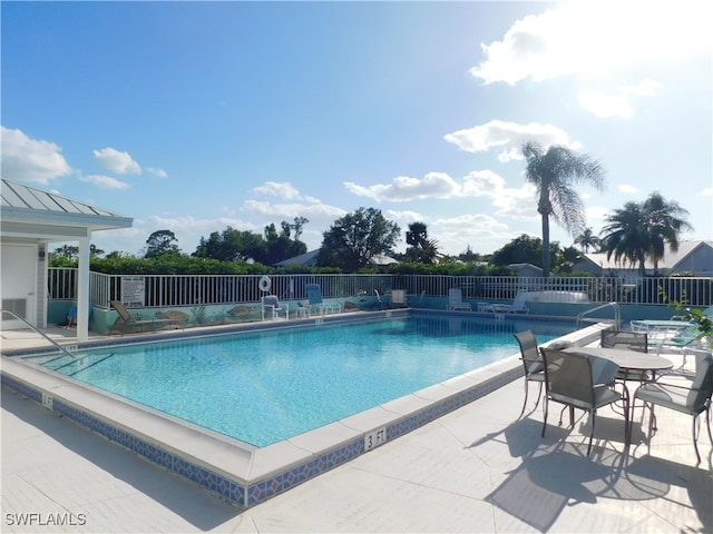 view of swimming pool with a patio area