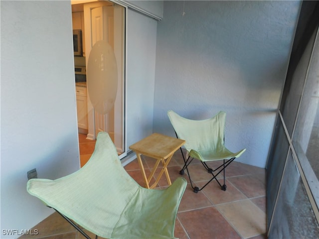 sitting room with tile patterned floors