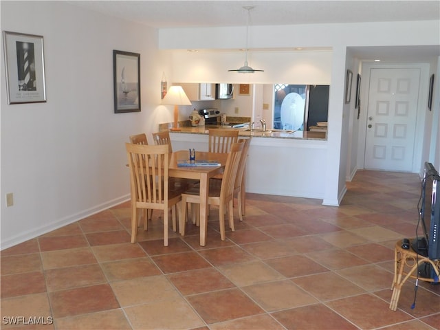 tiled dining space with sink