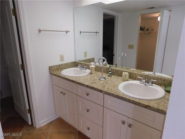 bathroom with vanity and tile patterned flooring