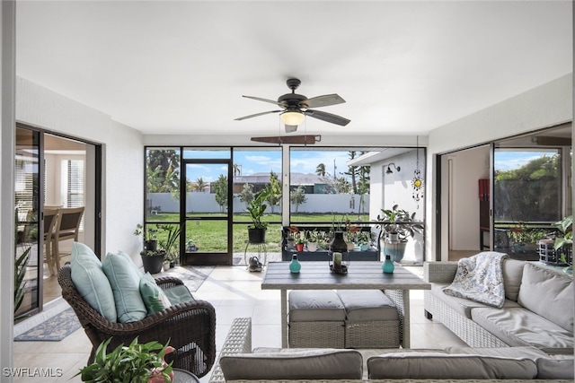 sunroom with a wealth of natural light and ceiling fan