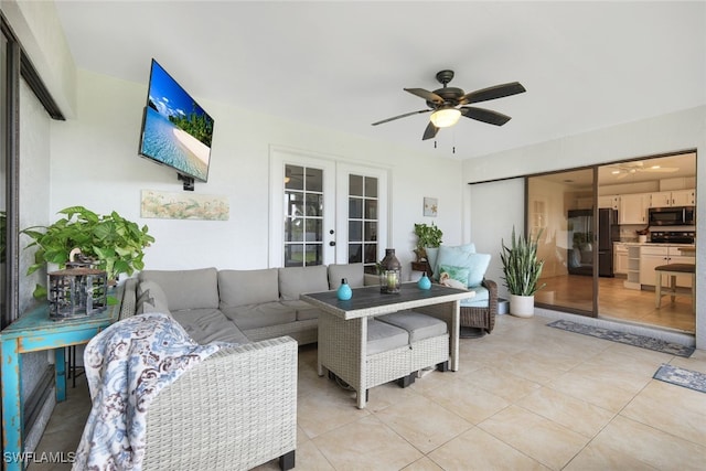 living room featuring french doors, ceiling fan, and light tile patterned floors